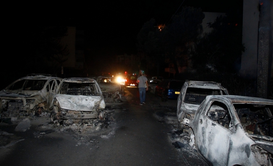 Φωτογραφίες από καμμένα αυτοκίνητα στο Μάτι