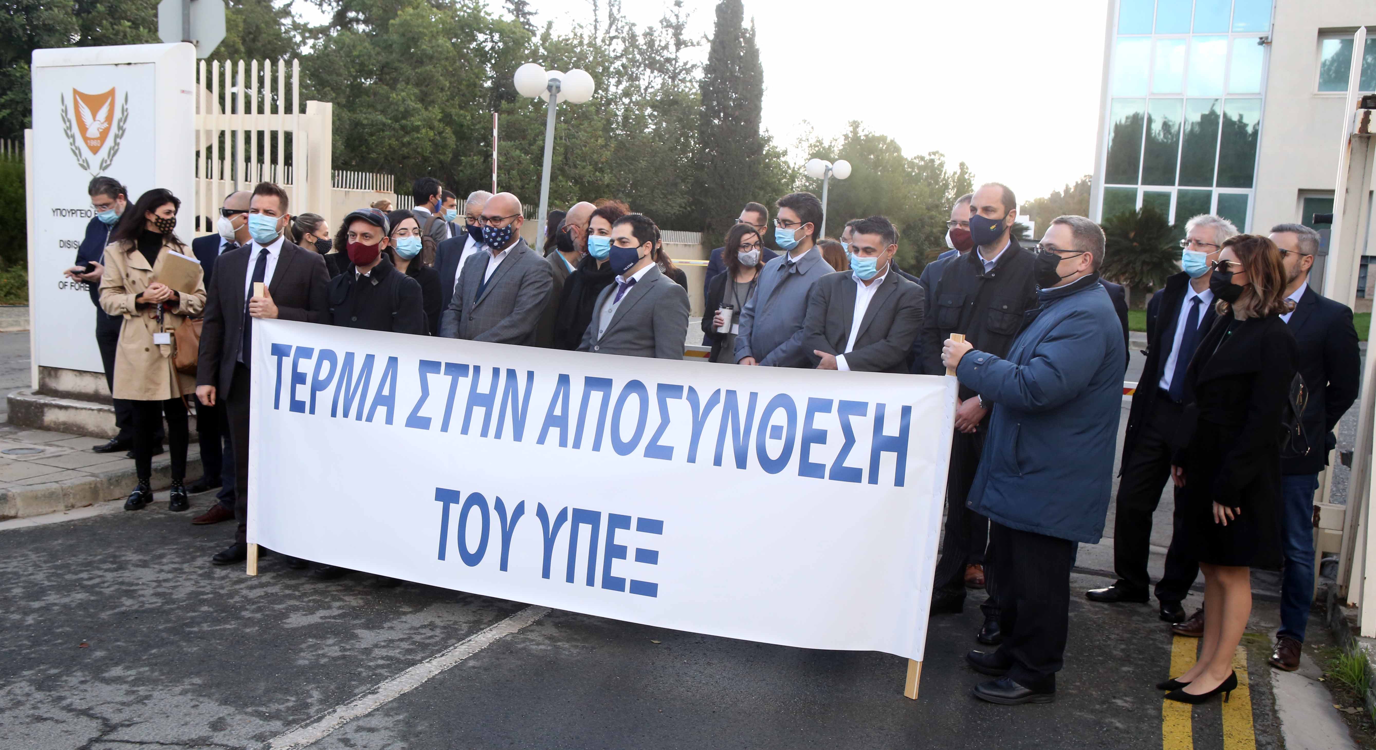 a group of people holding a sign